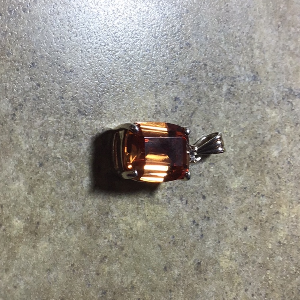 Beautiful dark rich orange stone nice cut.set in Sterling silver